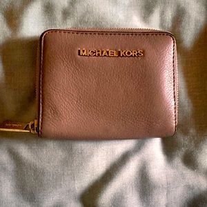 Michael Kors Compact Ziparound Wallet in Taupe color.